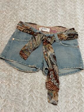 Levi's blue denim vintage shorts with patterned scarf belt.